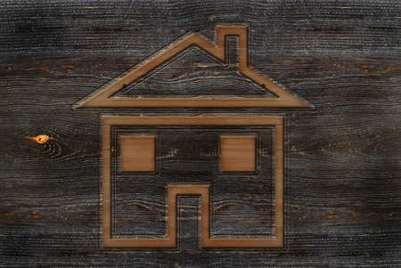 A wood carved house sign or icon illustrationの写真素材