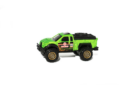 Green toy car isolated on white