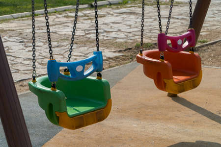 Playground swing in a parkの写真素材