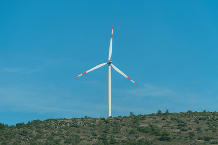 Wind turbines on green spring hills