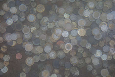 coins in the poolの写真素材