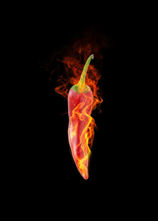 hot pepper on fire on black backgroundの写真素材