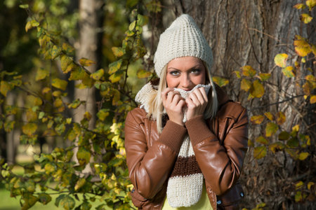 girl enjoying  in park in autumnの写真素材