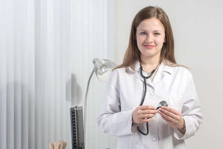 Portrait of a friendly doctor looking happyの写真素材