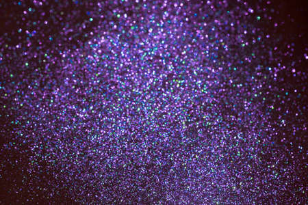 Blue and purple blurred sparkling glittering background. Festive backdrop.の写真素材
