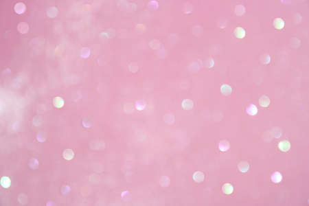 Pastel pink fairy blurred festive background. Sparkling glittering backdrop for design.の写真素材