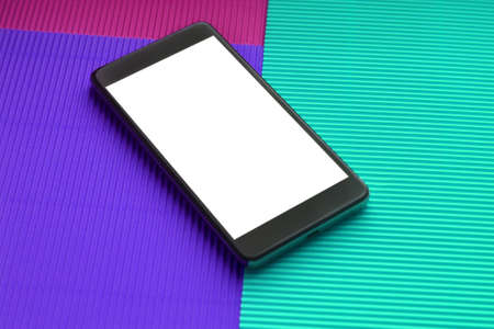 Top view mockup smartphone against trendy multicolor background. Minimal flat lay style.の写真素材
