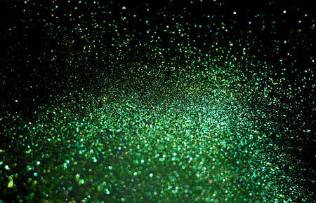 Green shiny festive background. Sparkling glittering backdrop for design.の写真素材