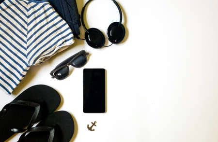 Flat lay traveler stuff on white background with copy space for text. Top view travel or vacation concept. Summer background.の写真素材
