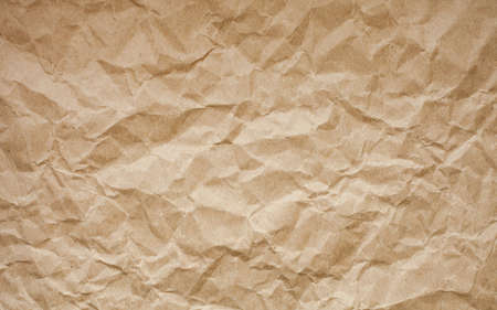 Brown crumpled paper background. Old paper texture. Ancient page pattern.の写真素材