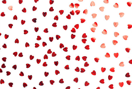 Red hearts confetti isolated on white. Valentine's day background with hearts. Romantic love...