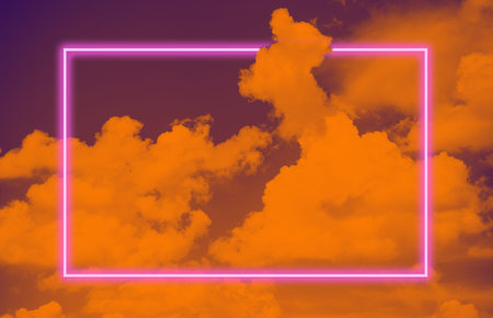 Vibrant sky with clouds layout and pink neon glowing frame. Vapor wave retro pattern for design....