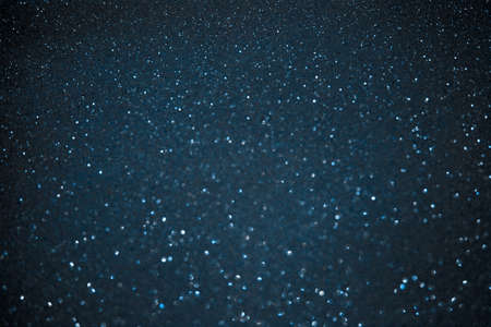 Color trendy blue glitter festive background. Sparkling glittering backdrop for design. 2020 trendの写真素材