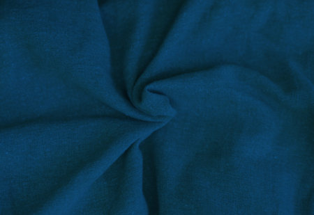 Crumpled blue fabric texture close up. Trendy tone of 2020 classic blue color, tissue backgroundの写真素材