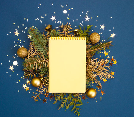 Stylish classic blue blank sheet of notepad for new year goals, Christmas greeting card. Golden and...