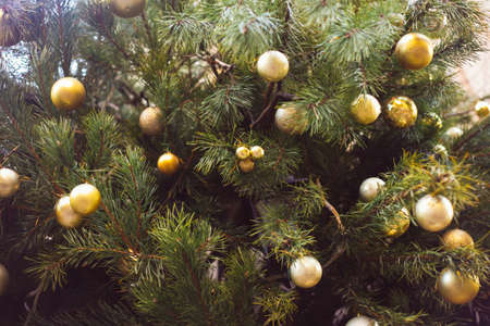 Close up of Christmas tree with lights and decorations, winter festive background, detailsの写真素材