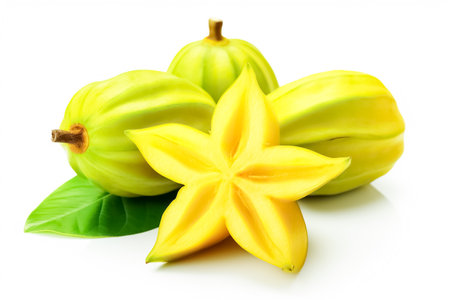 Starfruit, carambola with green leaves isolated on white background.の素材