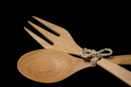 Wooden spool with black brackgroundの写真素材