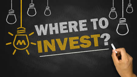 where to invest on blackboard backgroundの写真素材