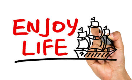 enjoy life concept and sailing boat hand drawing on whiteboardの写真素材
