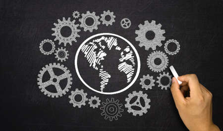 business concept: gears around earthの写真素材
