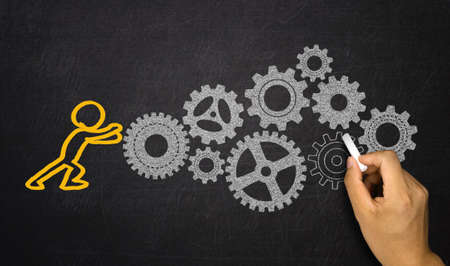 business concept:people activating gears mechanismの写真素材