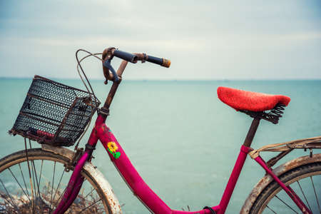 travel and relaxation concept: old bicycle at the seasideの写真素材