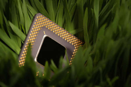 close-up of a computer cpu in a green meadowの写真素材