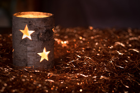 Wooden candle and golden glitterの写真素材