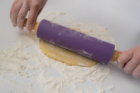 Rolling dough on flourの写真素材