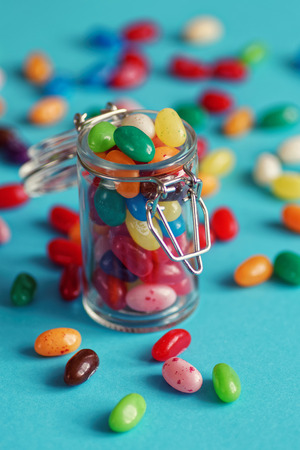 colorful jellybeans in glassの写真素材