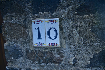 Number 10 on the wall of an old house in Tuscanyの写真素材