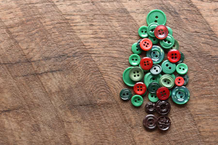 sewing buttons in the shape of a christmas treeの写真素材