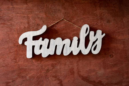 a wooden family sign on old barn boardの写真素材