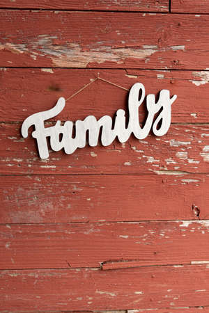 a wooden family sign on old barn boardの写真素材