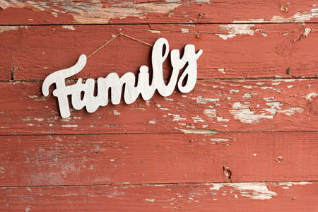 a wooden family sign on old barn boardの写真素材