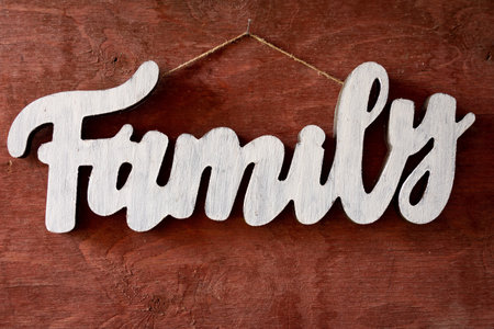 a wooden family sign on old barn boardの写真素材