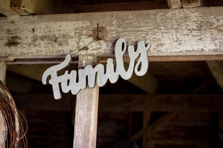 a wooden family sign on old barn boardの写真素材