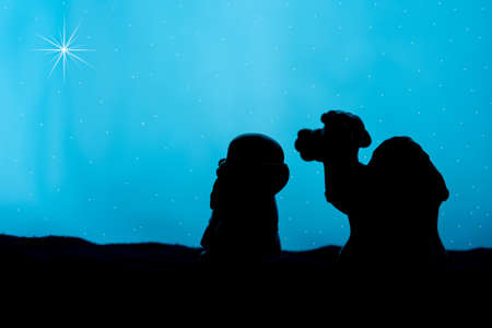 wiseman and camel   silhouette with star of Bethlehem and night sky.の写真素材