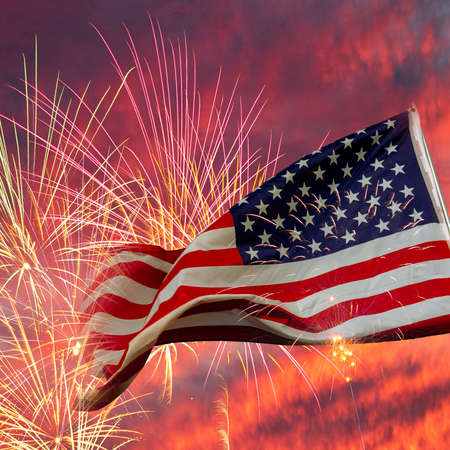 an American flag flying on a flag poleの写真素材