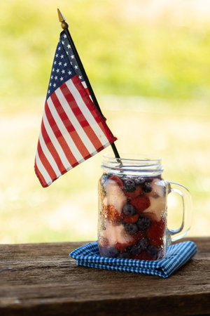 a red, white and blue fruit saled with a flagの写真素材