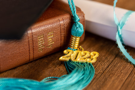 a 2023 graduation tassel on a bible with a capの写真素材