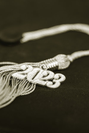 a 2023 graduation tassel on blackの写真素材