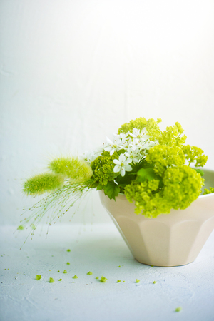 Beautiful flowers on the side of the window. Flower arrangement, Comfortable life.の写真素材