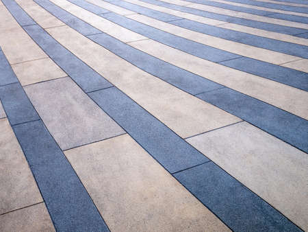 curved striped pattern abstract background of blue and brown sand wash floor a concrete surface finishing concept by closeup texture of sand or garvel ground for exterior and walkway designの写真素材