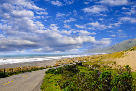 Coastal road next to a beach on the pacific oceanの写真素材