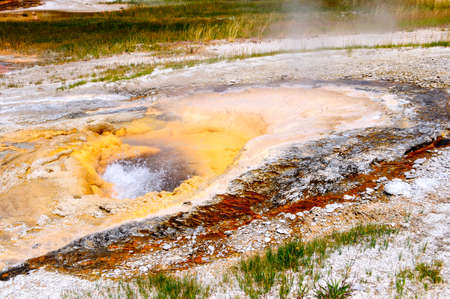 Pump Geyser erupting at Yellowstone National Parkの写真素材