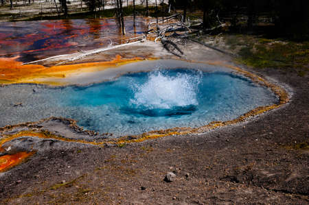 Firehole Spring bubbling at Yellowstone National Parkの写真素材