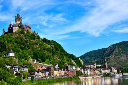 Castle Reichsburg sits above the medieval town of Cochem on the Mosel River, Germany.のeditorial素材