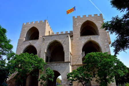 Torres de Serrano, or Serrans Gate, with the flag of Valencia Spain.の写真素材